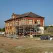 Site photograph, Station building with South elevation fire escape removed and scaffolding, Granton Gasworks, Edinburgh, Scotland