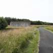 View of western extent of WW1 drying house area with WW2 explosives magazine (W25)