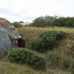 View from south south east of eroded WW1 blast mound (of paste magazine) containing WW2 Nissen Hut explosives magazine W3