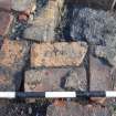 Trial Trench Evaluation photograph, Shot of markings 'ETNA' on bricks [1009], Salamander and Baltic Street, Leith, Edinburgh