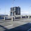 Ocean Terminal shopping centre.  Roof-top car park.  View of car park from south with the Port of Leith Distillery in the Background.