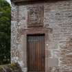 Careston Parish Church.  View of Laird's Loft doorway and heraldic panel of Sir Andrew Carnegy of Careston and Balnamoon, from west.