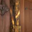 Careston Parish Church.  Porch.  Detail of brass hinge on interior entrance door.