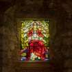 Careston Parish Church.  Chancel.  Detail of Alexander Campbell of Stracathro memorial stained glass window Christ the King by Stephen Adam c. 1910 with inscription below.