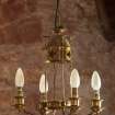 Careston Parish Church.  Chancel.  Detail of chandelier above choir stall.