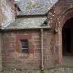 Careston Parish Church.  View of main entrance showing window to heating chamber, from north.