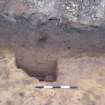 Evaluation photograph, Stone filled pit 017 in Trench 11 , Brunton Wireworks, Musselburgh, East Lothian