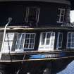 Exterior. Gun Deck, astern. View of rounded stern and Captain's cabin with roofed Upper Deck above