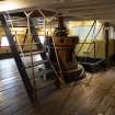Interior. Gun Deck. View towards light well for officers' cabin and mess area on Lower Deck and earlier capstan (for raising and lowering the anchor)