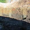 Excavation photograph, W facing section through Trough 028, 396-410 Gorgie Road, Edinburgh