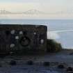 The view W from the W gun platform to the Forth Railway Bridge (NT17NW 70) rising above the mist