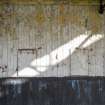 Detail of closed tote windows on back wall of stadium.