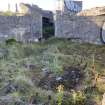 View from the E of the grass-grown holdfast at the centre of the gun pit in the NE emplacement 