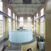 Interior. Carsfad Hydro Electric Power Station. Turbine House. View of one of the 6000Kw generator sets, its turbine sits below the set at basement level. Electrical current is generated under the light blue casing.