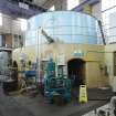 Interior. Carsfad Hydro Electric Power Station. Turbine/Power House. View of east generator set from south west. The stator and rotor sit within the light blue casing