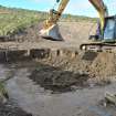 Watching Brief photograph, Working shot showing removal of interior deposit, Lyness Visitor Centre extension to Scapa Flow Museum, Lyness, Orkney