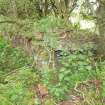 View of the SW corner of the latrine with a wastepipe from a W.C. in the foreground