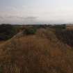 View from the WSW to the NW corner of the blast mound on the crest of the earthwork (Final Wash House W30)