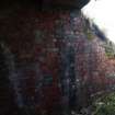 Detail of vertical black stripe painted on the brickwork of the narrow gauge railway tunnel (Final Wash House W30)