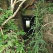 View of the exit of the brick-lined wash water gutter tunnel on the WSW side of the blast mound (Final Wash House W29)