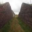 Explosives Magazine R65: view from the NNW of the course of the narrow gauge railway passing through the blast wall