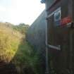 Nissen Hut W30, Hill No.1: a view of the tight fit between the foot of the WWI blast wall and the NNW side of the Nissen Hut