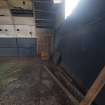 Interior, W1: the boarded-up entrance adjacent to the NW corner of the ammunition store