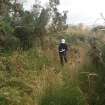 View WSW of the open channel leading out on to the hillside from the exit of the wash water gutter tunnel (Final Wash House W29)