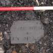 Watching Brief photograph, Tomb slab in with levelling material 002, Falkirk Town Centre Regeneration, Falkirk