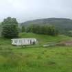 Evaluation photograph, E end of site with post supporting overhead cables, Facing SW, Land west of Old Kirk, Spittal of Glenshee
