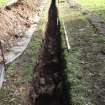 Excavation photograph, Possible cobbled floor surface and wall taken from NNW, Carzield Roman Fort, Kirkton, Dumfries