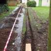 Excavation photograph, Trench secured with planks and hazard tape taken from NNW, Carzield Roman Fort, Kirkton, Dumfries