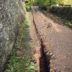 Excavation photograph, Surface (020) taken from SE, Wellington Bridge, Carzield Roman Fort, Kirkton, Dumfries