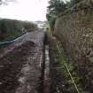 Excavation photograph, Surface (020) taken from NW, Wellington Bridge, Carzield Roman Fort, Kirkton, Dumfries