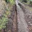 Excavation photograph, Surface (021), photos taken at intervals along its length taken from SE, Wellington Bridge, Carzield Roman Fort, Kirkton, Dumfries