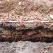 Excavation photograph, Surface (034) in SW facing section taken from SW, Wellington Bridge, Carzield Roman Fort, Kirkton, Dumfries