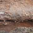 Excavation photograph, NE facing section of [022] taken from SW, Wellington Bridge, Carzield Roman Fort, Kirkton, Dumfries