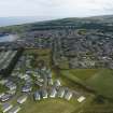 Oblique aerial view from north-west showing Recreation (Holiday Park), Mid- to Late C20 (Barefoots) and Mid- to Late C20 (Deanhead) Areas of Townscape Character, Eyemouth