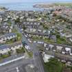 Oblique aerial view from south-west showing Mid- to Late C20 (Deanhead), Mid- to Late C20 (Barefoots) and Inter-War (Hurkur Crescent and Schools) Areas of Townscape Character, Eyemouth