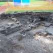 Excavation photograph, NE corner with concrete and tenement foundations - cleaned, Paisley Abbey, Renfrewshire