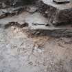 Excavation photograph, Cleaning next to concrete, walling appearing - wet, Paisley Abbey, Renfrewshire