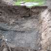 Excavation photograph, Initial machining to west of manhole, Paisley Abbey, Renfrewshire