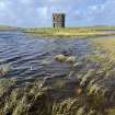 Dun Scolpaig, general view from E with remains of causeway in foreground