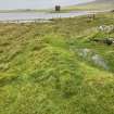 Dun Scolpaig, general view from S showing the drainage hood of blackhouse that is cut into the approach to the tower.