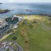 Oblique aerial view from south showing Recreation (Golf Course) and Historic Burgh and Harbour Areas of Townscape Character, Eyemouth