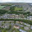 Oblique aerial view from east showing Modern (Gunsgreenhill), Mid- to Late C20 (The Avenue), Victorian Expansion, Mid- to Late C20 (Gillsland) and Historic Burgh and Harbour Areas of Townscape Character, Eyemouth