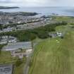 Oblique aerial view from south showing Recreation (Golf Course), Modern (Gunsgreenhill), Mid- to Late C20 (The Avenue) and Historic Burgh and Harbour Areas of Townscape Character, Eyemouth