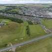 Oblique aerial view from east showing Recreation (Golf Course), Mid- to Late C20 (The Avenue) and Historic Burgh and Harbour Areas of Townscape Character, Eyemouth