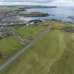 Oblique aerial view from south-east showing Recreation (Golf Course), Mid-to Late C20 (The Avenue) and Historic Burgh and Harbour Areas of Townscape Character, Eyemouth