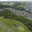 Oblique aerial view from north-north-east showing Recreation (Golf Course), Mid- to Late C20 (The Avenue), Victorian Expansion, Inter-War (Hurkur Crescent and Schools) and Historic Burgh and Harbour Areas of Townscape Character, Eyemouth